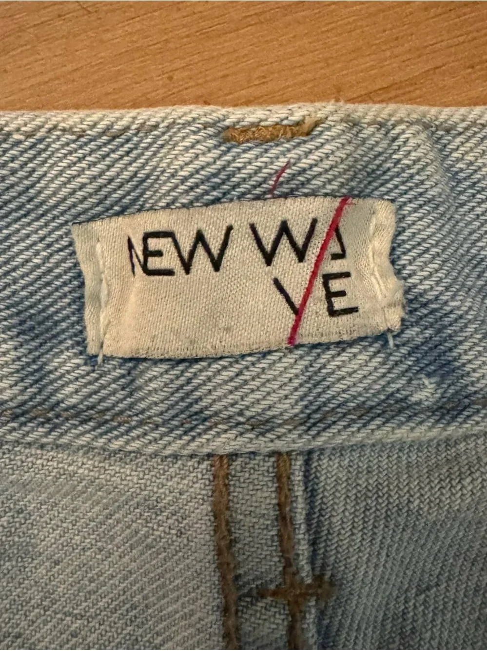 High-Rise Light Blue Denim Jeans with Frayed Hem